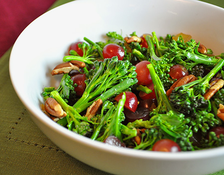 broccoli salad with red grapes and toasted nuts